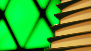 Artistic rendition of a book stack on green background