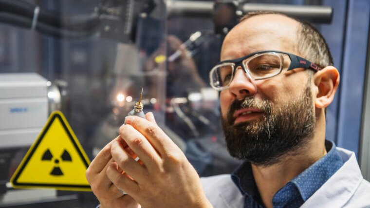 Dr Phil Köhler with a single-crystal sample